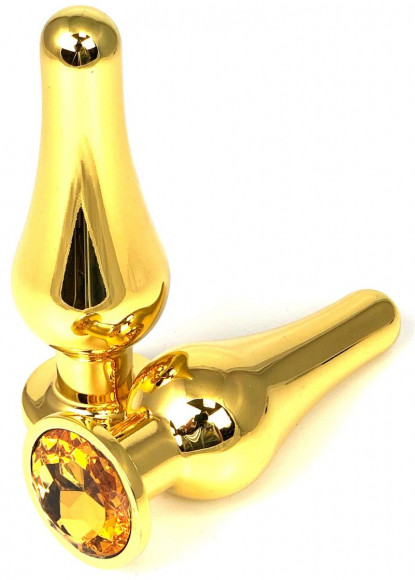 Золотистая удлиненная анальная пробка с оранжевым кристаллом - 8 см. Золотистая удлиненная анальная пробка с оранжевым кристаллом - 8 см.