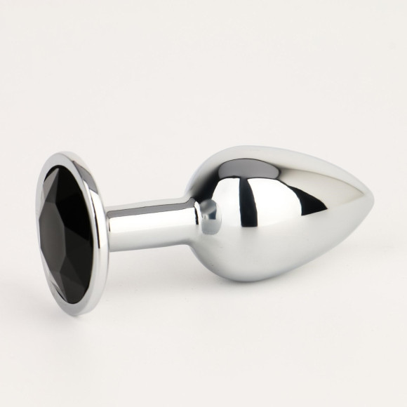 Серебристая анальная втулочка с черным кристаллом - 7 см. Серебристая анальная втулочка с черным кристаллом - 7 см.